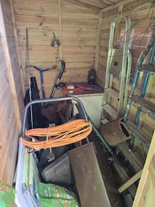 Garden shed filled with rubbish